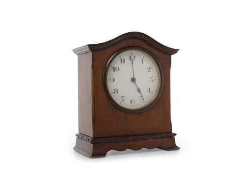 EDWARDIAN MANTEL CLOCKSwiss made movement, white enamel dial with Roman numerals, contained in an arched mahogany case, raise