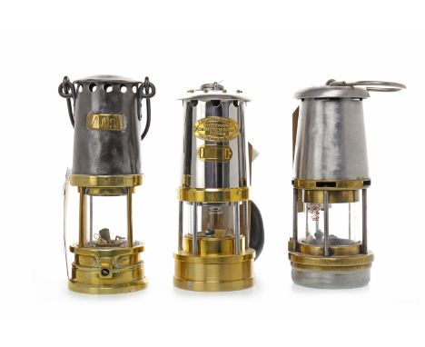 MINER'S SAFETY LAMP CAMBRIAN TYPE 62 NO. B2/232by E. Thomas & Williams, 21cm high; along with Marsaut safety lamp 408; and Wo