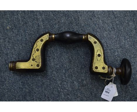 An early brass and ebony filled carpenters brace by Alfred Ridge.