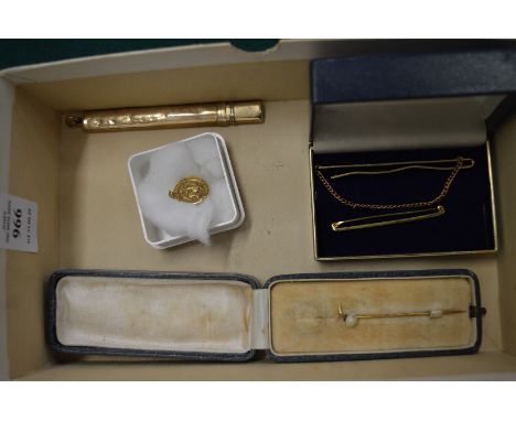 A 9ct gold tie clip and other items.