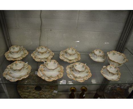 A set of eight Foley china porcelain cups and saucers of lobed shape together with a set of six matching tea plates and a slo