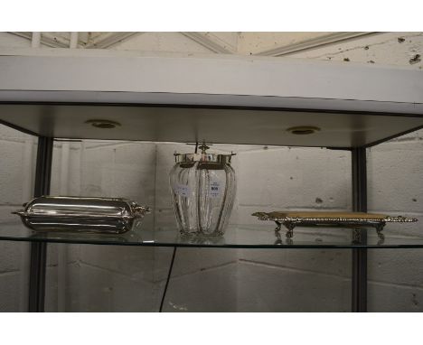 A cut glass biscuit jar with plated mounts together with a plated entree dish and cover and a cheese board with plated stand.