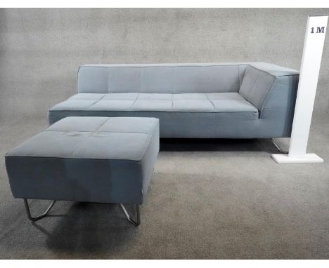 A contemporary corner sofa in piped and stitched upholstery raised on metal tubular supports along with the matching footstoo