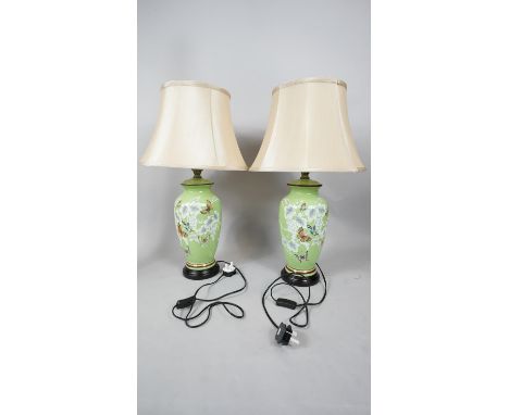 A pair of contemporary Chinese style green ceramic vase table lamps hand decorated with vines, grapes and butterflies with cr