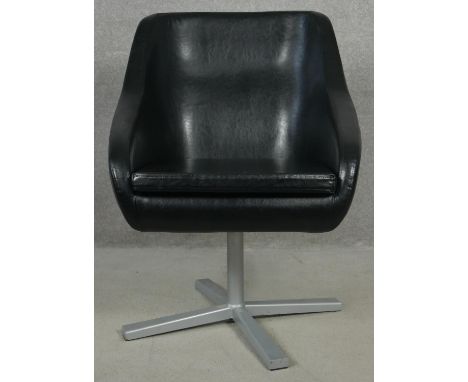 A retro vintage design swivel desk chair in faux leather upholstery on metal base. H.78cm 