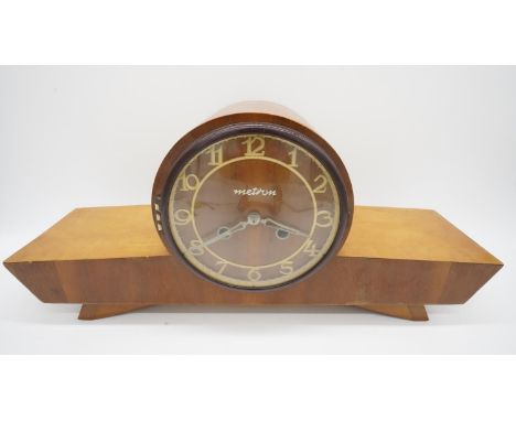 A Mid-Century birch cased chiming mantel clock by Metron. With makers label to the back and key. H.26 W.53 D.14 