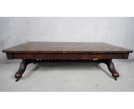 A 19th century rosewood, satinwood and ebony marquetry topped low table on bobbin stretchered cabriole supports. H.40 W.128 D