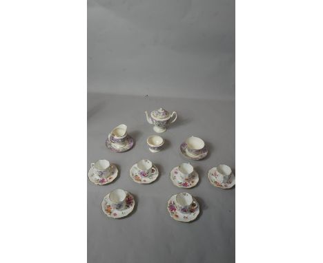 Six porcelain Royal Crown Derby, 'Derby Posies' cups and saucers along with a one person Booths 'Vauxhall' purple design tea 