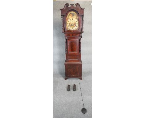 A Georgian mahogany and satinwood inlaid longcase clock with Roman numerals to the painted moonphase dial, spandrels and face