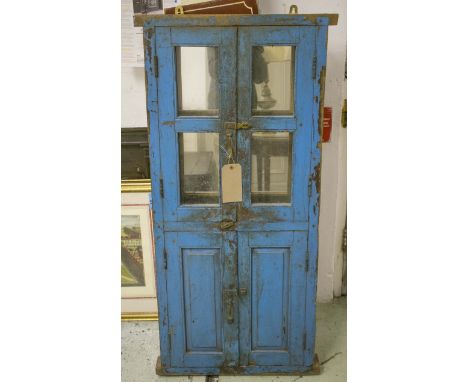 WALL MIRROR, Indian distressed blue painted with two pairs of doors opening to reveal mirrors, 62cm x 132cm H.