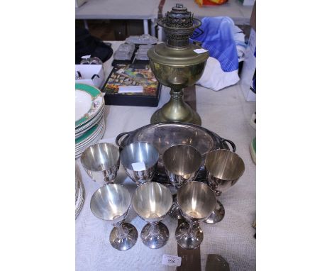 A job lot of assorted plated ware and a brass oil lamp base 