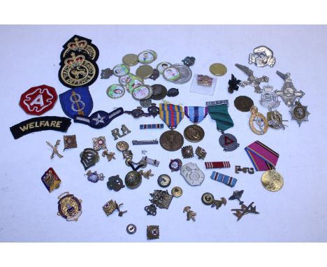 Tin of assorted enamel badges patches and medals including military 