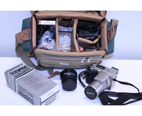 A selection of assorted camera equipment including an Olympus Camedia 