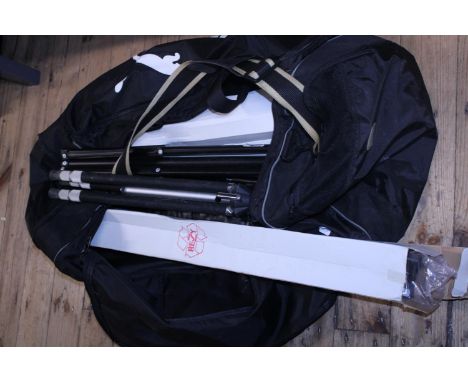 A puma holdall full of assorted camera tripods.  Shipping unavailable 