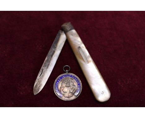 A hallmarked silver bladed pen knife with MOP decoration and a hallmarked silver and enamel pendant 