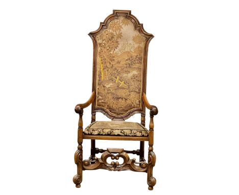 A large Late 19th Century Carolinian style walnut armchair, with original tapestry back and seat. Circa 1880-1890.