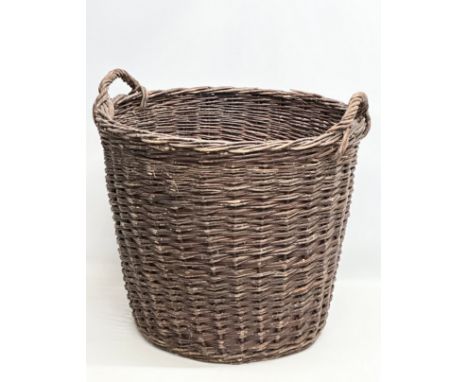 A large vintage wicker basket. 62x58cm