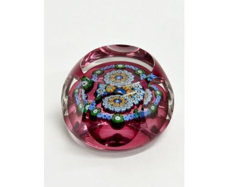 A Perthshire millefiori glass paperweight.