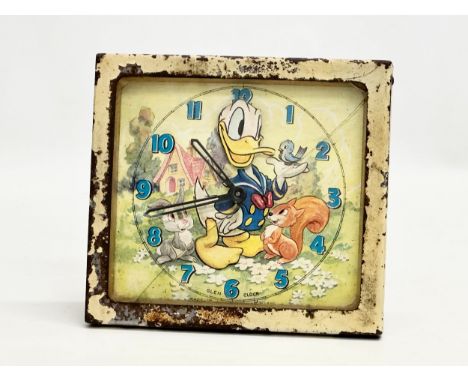 A 1940’s Walt Disney Donald Duck mantle clock. Glen Clock. Made in Scotland. 14x5x13cm.