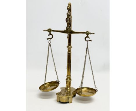 Late 19th/Early 20th Century brass justice scales. 41cm