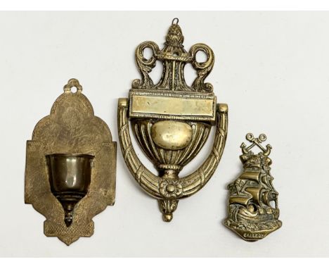 Victorian brassware. A Late 19th Century brass door knocker 21cm. A small Galleon style door knocker 11cm. A brass wall pocke