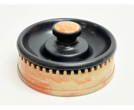 An Art Deco Bakelite ashtray match striker. By Roanoid for Roxon. 13x6cm.