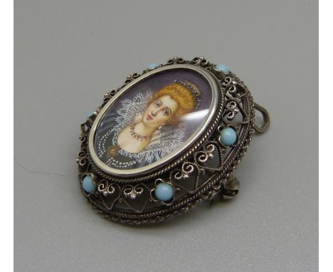 An 800 silver brooch with painted portrait 