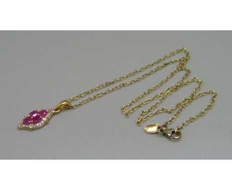 A silver gilt, ruby and zircon pendant 