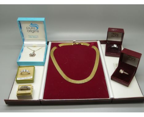 A silver gilt necklace, a silver and opal pendant and chain, a 9ct gold and silver eternity ring and three silver rings 