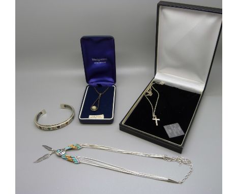 A silver torq bangle, a silver Wedgwood pendant and chain and two other silver necklaces 