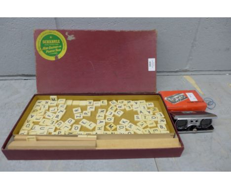 A pair of folding binoculars and a vintage Scrabble set 