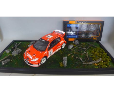 A model car, Solido 1/18th scale, a wheel set, and diorama 