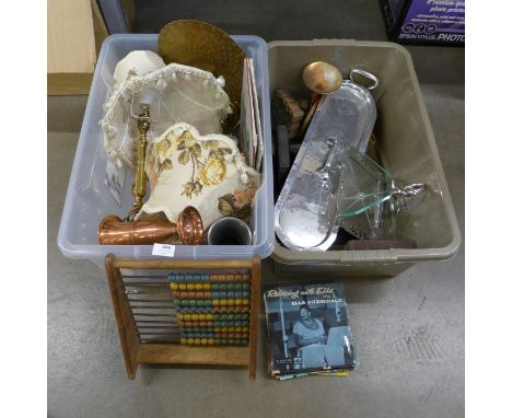 Two boxes of assorted items including printing blocks, a cake stand, a pair of table lamps, a copper horn, a fish kettle, an 