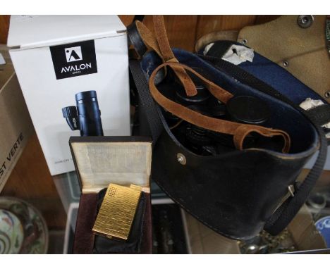 A cased pair of binoculars, a boxed Avolon monocular&nbsp; and a boxed gold coloured Ronson lighter