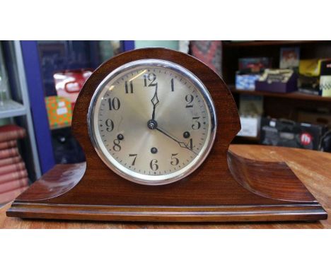 A mahogany Napoleons hat chiming mantel clock.