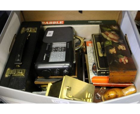 A box containing a Rapport of London carriage clock with home office accessories, portraits and useful boxes.&nbsp;