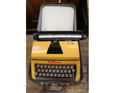 A tartan cased Lilliput manual typewriter.