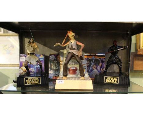 A shelf of Star Wars branded merchandise, to include puzzles &amp; figurines