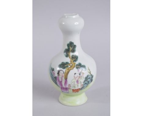 A CHINESE FAMILLE ROSE PORCELAIN WALL VASE, enamel-painted with two figures, six-character mark to base, 21.3cm high.