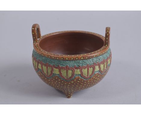 AN UNUSUAL CHINESE CARVED AND PAINTED TWIN HANDLE TRIPOD CENSER, character mark to base, 12cm wide.