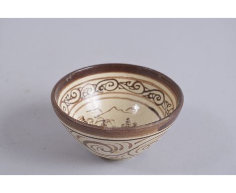 A CHINESE CIZHOU POTTERY TEA BOWL.