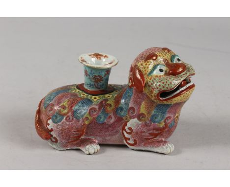 A VERY FINE CHINESE FAMILLE ROSE POTTERY KYLIN CANDLE HOLDER, 18cm long.
