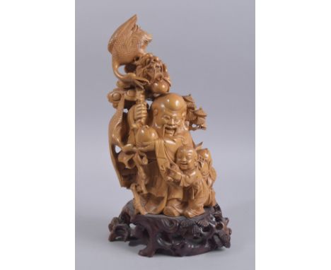 A LARGE CHINESE CARVED WOOD FIGURE OF SHAO LAO AND A CHILD, with dragon and crane upon his staff, mounted to a hardwood base,