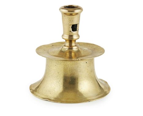 SMALL FLEMISH BRASS 'HEEMSKERK' CANDLESTICK 17TH CENTURY with pierced nozzle above a dished drip tray and a spreading circula