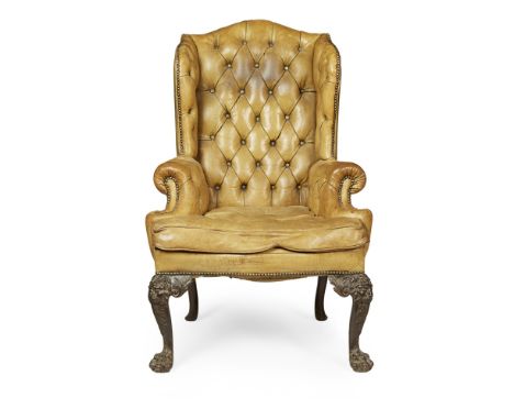 GEORGE II STYLE IRISH MAHOGANY LEATHER WING ARMCHAIR  19TH CENTURY  the arched back and shaped wings above a loose cushion se