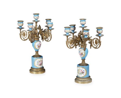 PAIR OF CONTINENTAL PORCELAIN AND GILT METAL CANDELABRA 19TH CENTURY in the Sevres style, with central urns issuing one stiff