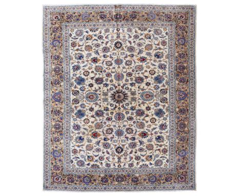 KASHAN CARPET CENTRAL PERSIA, MID-20TH CENTURY the cream field with small indigo medallion and allover palmette and foliate v