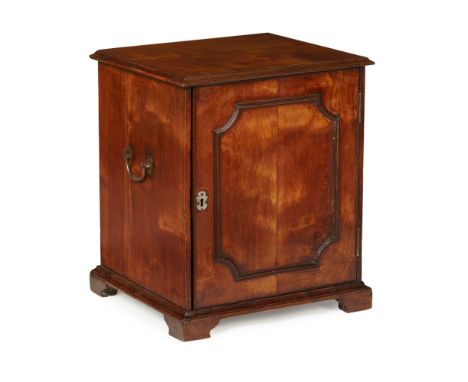 GEORGE III PEARWOOD TABLE CABINET 18TH CENTURY of cubic form, the moulded door opening to drawers, with brass handles to the 