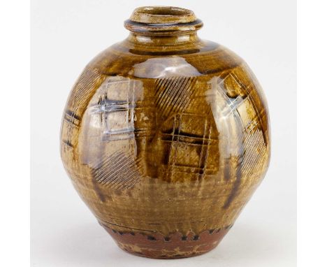 † MIKE DODD (born 1943); a lightly faceted stoneware bottle covered in granite and iron glaze with paddled decoration, impres