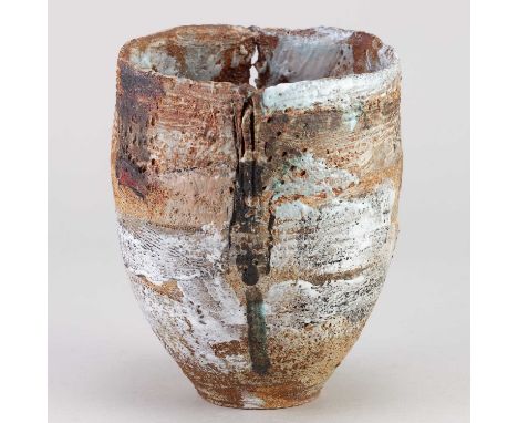 † ROBIN WELCH (1936-2019); a stoneware vessel with pierced rim partially covered in white and black glaze with red and salmon